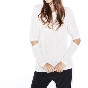 LNA Durango sweater with exposed elbow holes.